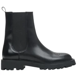 Botines negros de cuero con perforaciones decorativas