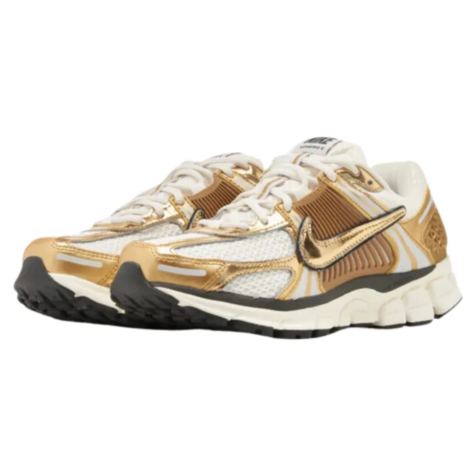 Zapatilla de running mujer oro metálico